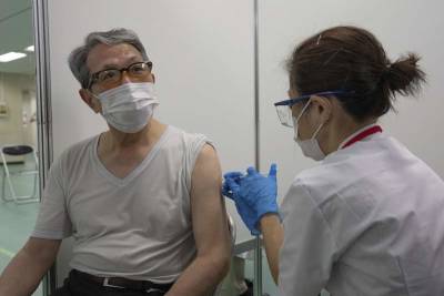 Yoshihide Suga - Japan opens mass vaccination centers 2 months before Games - clickorlando.com - Japan - city Tokyo