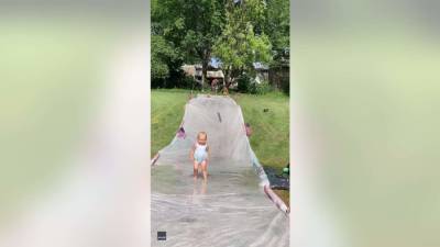 Dad with lightning-fast reflexes catches toddler on slip ‘n slide - fox29.com - state Iowa
