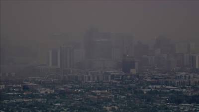 Wall of dust makes its way over Phoenix during busy monsoon season - fox29.com - state Arizona