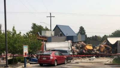 Driver charged after dump truck plows into cars, buildings - fox29.com - state Washington - county Spokane