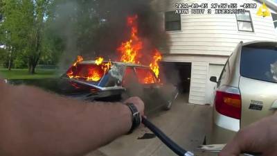 Bodycam video: Deputy pulls burning car away from home in Chisago County - fox29.com - state Minnesota
