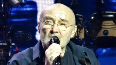 Phil Collins - Phil Collins Says He Can No Longer Play Drums Due to Health Issues - etonline.com