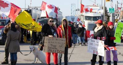 Police warn about significant delays at Ambassador Bridge as protest continues into 4th day - globalnews.ca - Canada