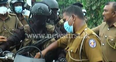 Police confront armed masked men in unregistered bikes at parliament protest - newsfirst.lk - Sri Lanka
