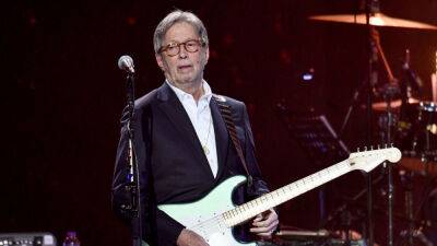 Eric Clapton - Gareth Cattermole - Eric Clapton positive for COVID-19, postpones concerts - foxnews.com - Britain