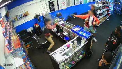 VIDEO: Gun battle erupts after store employee returns fire on would-be robbers - fox29.com - county Los Angeles - city Wilmington - city Compton