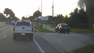 WATCH: Florida driver uses sidewalk to avoid rush hour traffic, deputies say - fox29.com - state Florida - county Sarasota