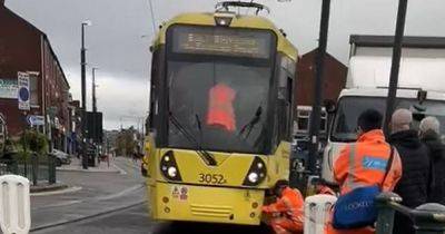 Emergency services line street after lorry smashes into tram - manchestereveningnews.co.uk - city Manchester - county Oldham