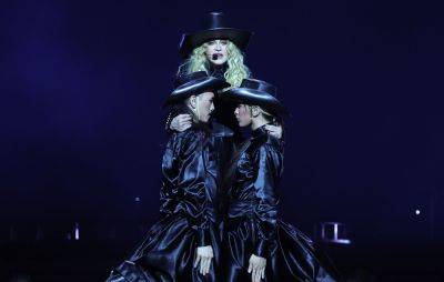 Watch Madonna’s smooth recovery after falling off a chair during show - nme.com - Usa - Britain - city Seattle