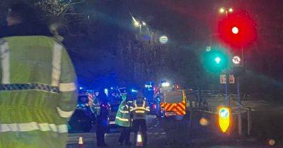 Huge emergency services presence and police helicopter after 'serious' crash closes main road - manchestereveningnews.co.uk - city Manchester
