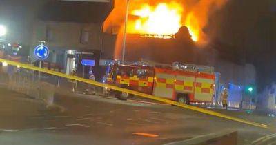 Huge fire rips through flats in Falkirk as emergency services race to scene - dailyrecord.co.uk - Scotland