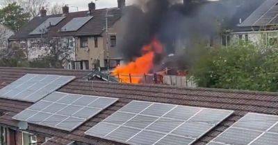 Dramatic footage shows fire burning at house in Stockport before emergency services swarm area - manchestereveningnews.co.uk - city Manchester