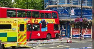 Seven people treated by medics with four in hospital as double-decker bus crashes into scaffolding in London - manchestereveningnews.co.uk - city London